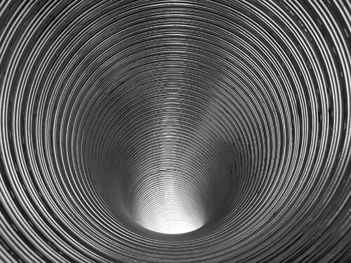 Corrugated zinc tube closeup.